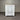White dresser with multiple drawers against a corrugated metal wall.