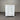 White dresser with multiple drawers against a gray corrugated metal background