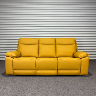 Yellow sofa against a metallic shutter background
