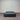 Charcoal fabric, bed base, made in New Zealand, pine wood, corner guard protection, on a gray floor with a striped wall background