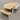 Wooden outdoor table and bench set with chairs on a concrete surface