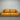 Tan Brown leather sofa against a metallic shutter background