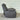 Gray recliner chair against a metallic background