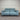Blue sofa against a striped wall