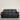 Black leather sofa on a wooden floor with a neutral wall background