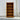 Wooden bookshelf against a white wall
