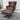Brown leather armchair with ottoman on a wooden floor