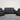 Black leather reclining sofa set on a wooden floor with a neutral background