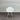 White chair against a corrugated metal wall