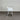 White chair against a corrugated metal wall