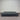 Charcoal fabric, bed base, made in New Zealand, pine wood, corner guard protection, on a gray floor with a striped wall background