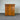 Wooden dresser with multiple drawers against a corrugated metal wall - wanaka collection