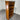 Wooden bookshelf with a drawer against a corrugated metal wall. Wanaka collection