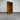 Wooden bookshelf against a metallic shutter background wanaka collection
