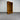Wooden bookshelf against a metallic shutter background wanaka collection