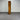 Tall wooden cabinet against a metallic shutter background - wanaka collection