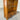 Wooden bookshelf with a single drawer on a concrete floor. wanaka collection.