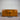 DFO, Wanaka, Wooden sideboard, 1800mm, with three drawers, two cupboards, Chestnut Pine finish, stained pine, DFO, NZ, against a corrugated metal wall. Wanaka collection