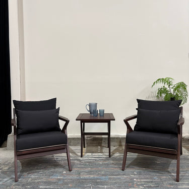 Angled outdoor patio view showing two armchairs and side table from the Contemporary set.