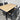 Close-up of Kartini table showing natural timber-look slats and anodised aluminium frame detail.
