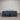 Workhorse LUX mattress king size with matching base, front view showing grey quilted top, dark upholstered base and caster feet against corrugated backdrop