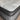 Close-up of Workhorse LUX mattress corner showing pillow top with grey quilted fabric, black piping, and textured stitching details