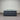 Workhorse LUX mattress with matching base, front view showing quilted top, dark upholstered fabric and brand label against corrugated backdrop