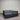 Workhorse Mattress with matching base, front angled view showing grey quilted top, dark upholstered base, and Hotel Mattress Co label against corrugated backdrop.