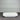 White rectangular marble coffee table against a gray wall.