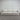 Gray sofa against a metallic wall