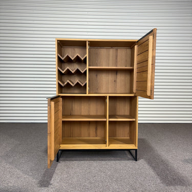 All cabinet doors open revealing internal storage layoutAll cabinet