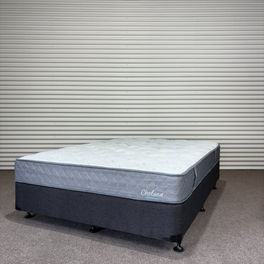 Mattress with a visible brand logo on a plain background
