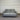 Gray sofa against a striped wall.