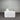 White sofa against a corrugated metal wall