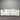 White sofa against a corrugated metal wall
