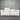 White sofa against a corrugated metal wall