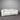 White sofa against a gray corrugated metal wall