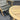 Wooden chair and round table on a gray carpet