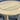 Round wooden table with a slatted top on a gray background