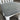 Gray cushioned chair seat on a white chair with a neutral background. Kinloch collection