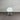 White chair against a corrugated metal wall
