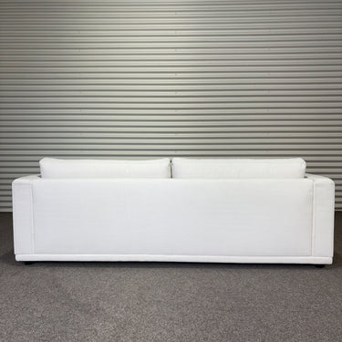 White sofa against a metallic wall