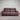 Burgundy leather sofa against a metallic shutter background