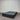 Charcoal fabric, bed base, made in New Zealand, pine wood, corner guard protection, on a gray floor with a striped wall background
