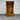 Wooden bookshelf with a drawer against a corrugated metal wall. wanaka collection