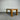 Wooden table against a corrugated metal wall