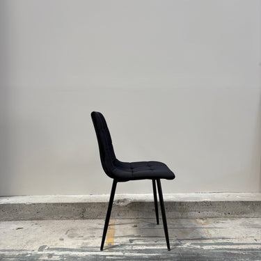 Slim dining chair side view showing seat contour and tapered legs