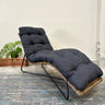 Dario Outdoor Sunlounge in natural wicker with deep charcoal cushion, front angled view.