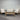 Front view of Journey outdoor lounge set with sofa, chairs, and coffee table in natural timber and light cushions