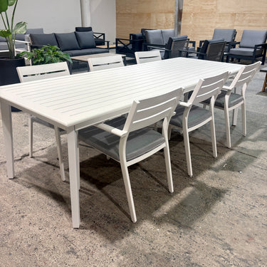 Side view of Mantra 2600mm dining table and six matching Retreat Grey cushioned chairs